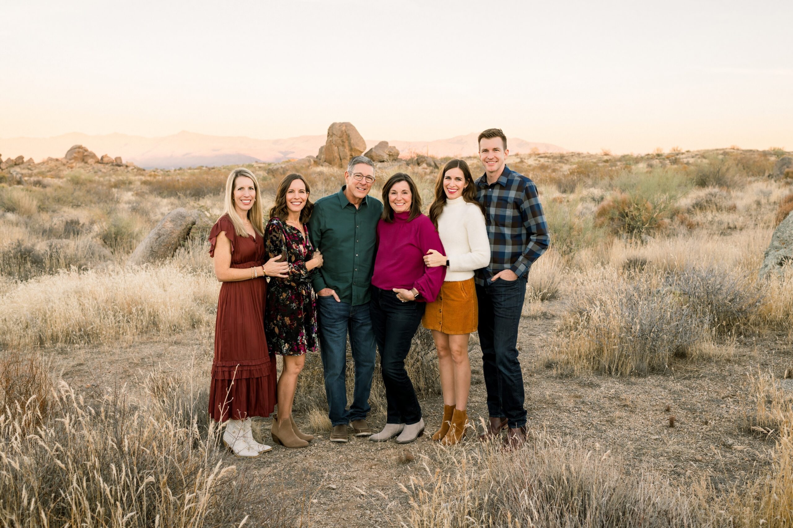 family of 6 in the arizona desert in cave creek arizona at sunset smiling at the camera