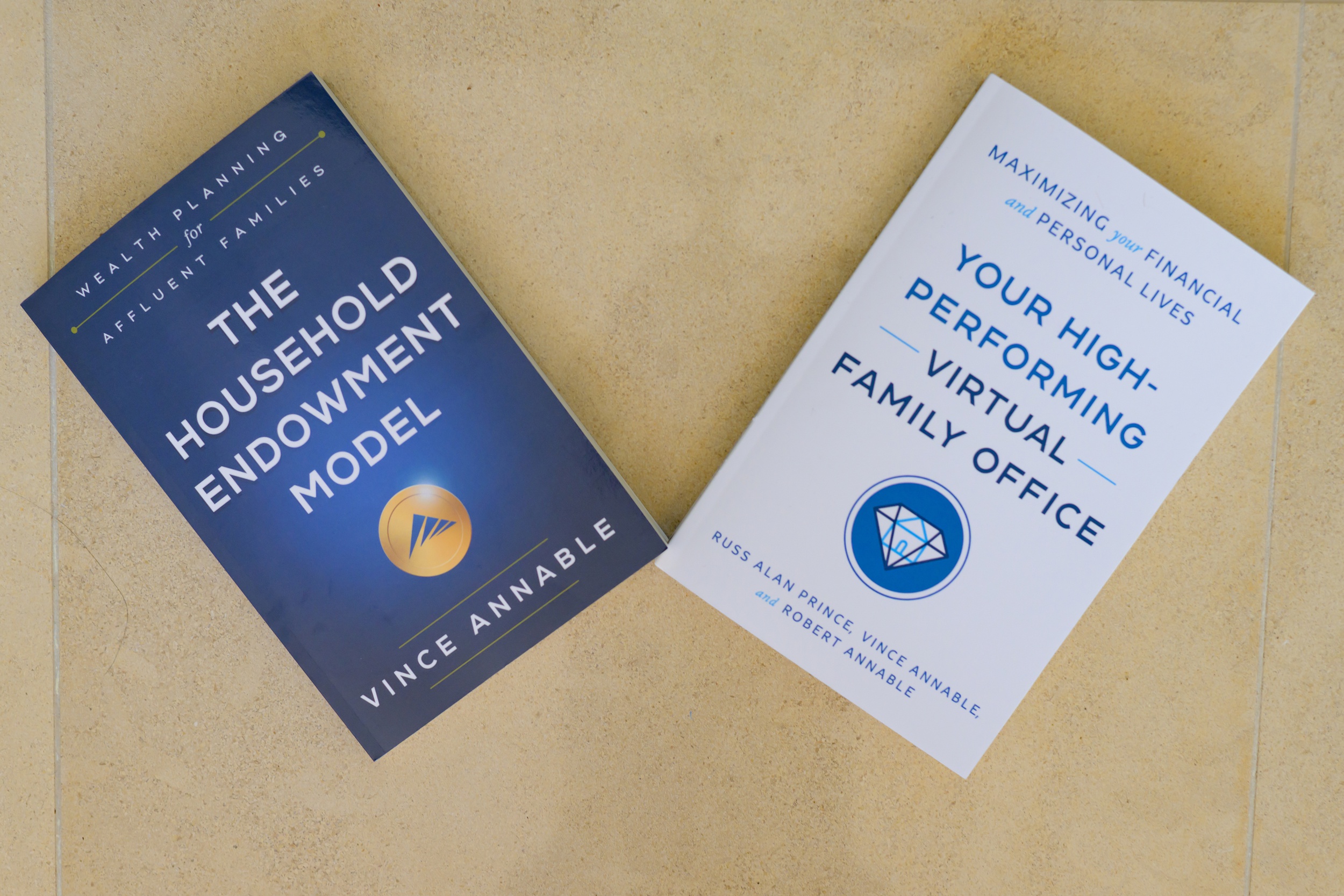 Details of two books laying on tile used to update brand photos